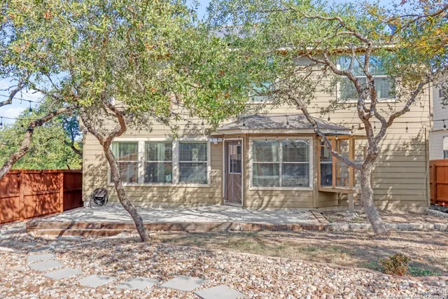 a view of a yard with large tree