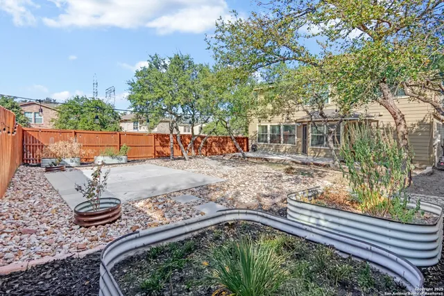 a view of a yard with trees