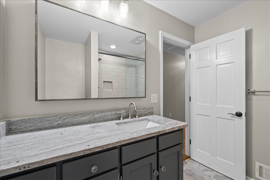 103 Satula Lane Clemson, SC 29631 - Photo 24 of 50 This bathroom features a sophisticated vanity with ample counter space and a sleek, contemporary design.