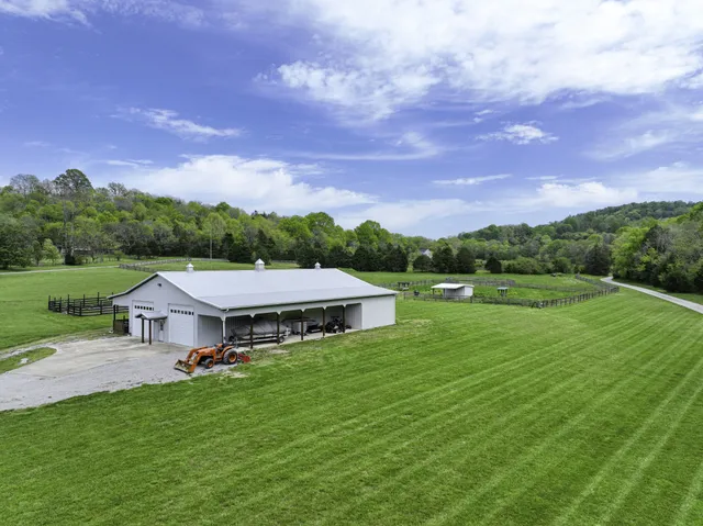 a living room with furniture a flat screen tv and a window