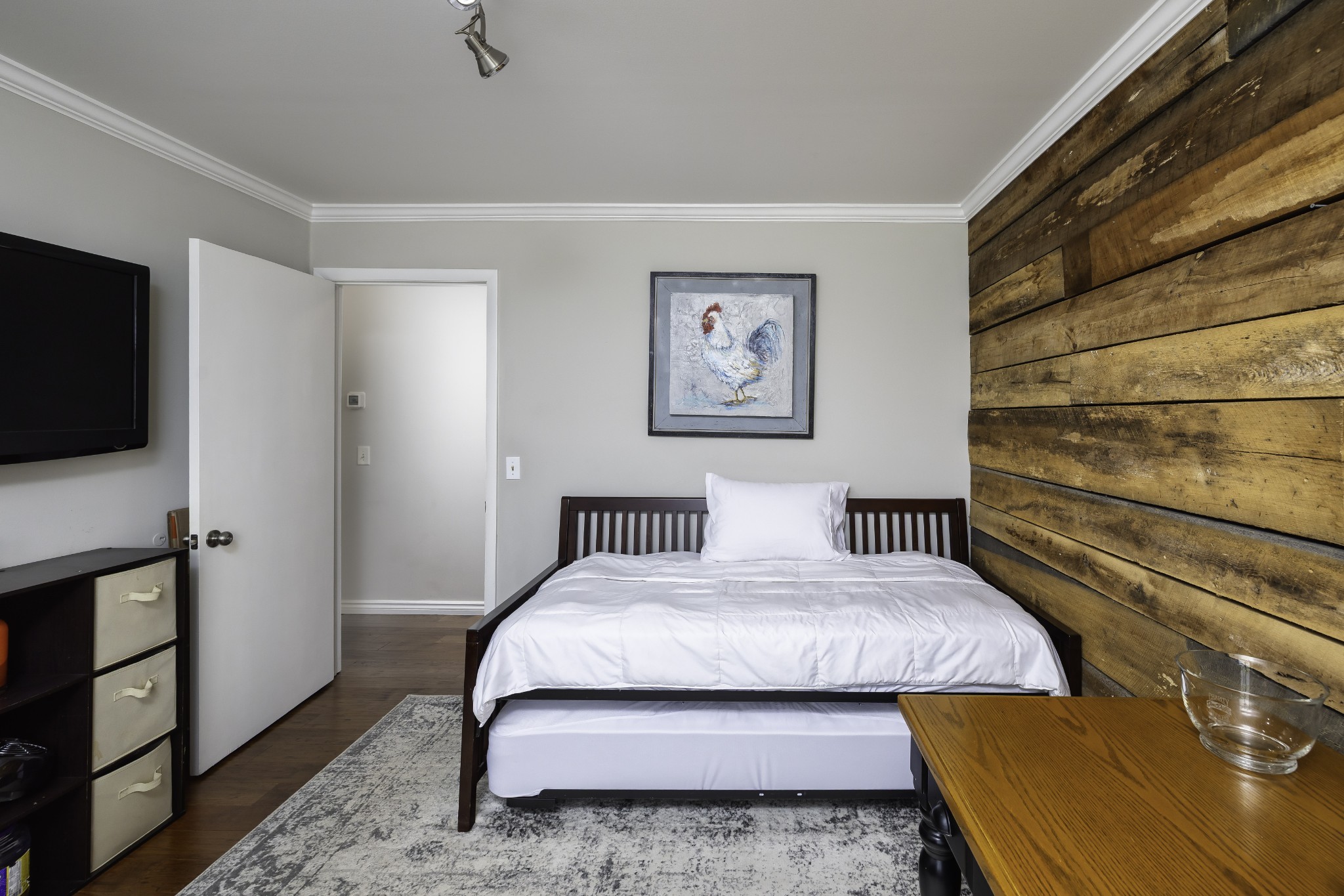 6865 Flat Creek Road College Grove, TN 37046 - Photo 43 of 66 a bedroom with a bed and a flat screen tv