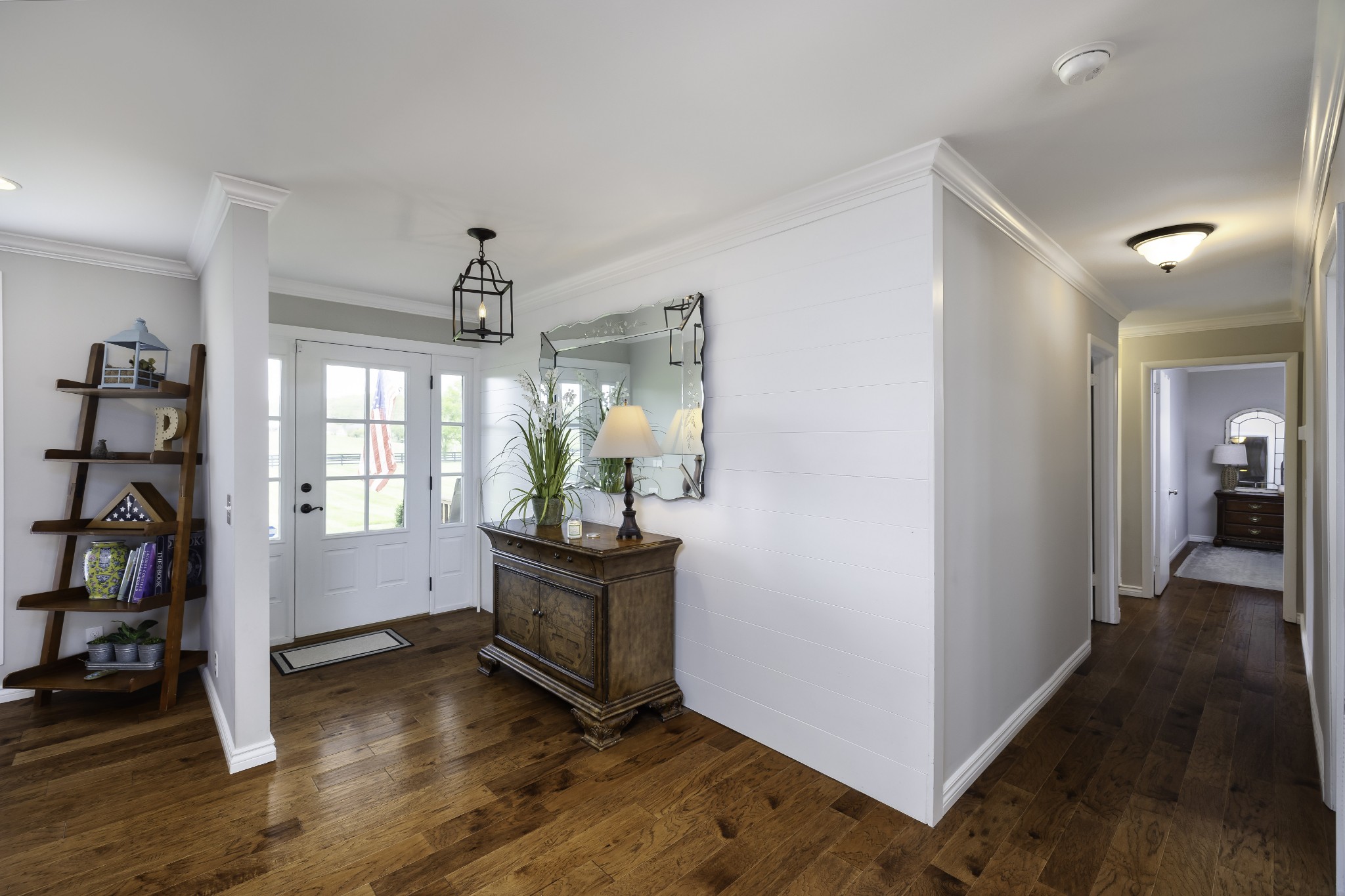 6865 Flat Creek Road College Grove, TN 37046 - Photo 66 of 66 a view of entryway with wooden floor and cabinet