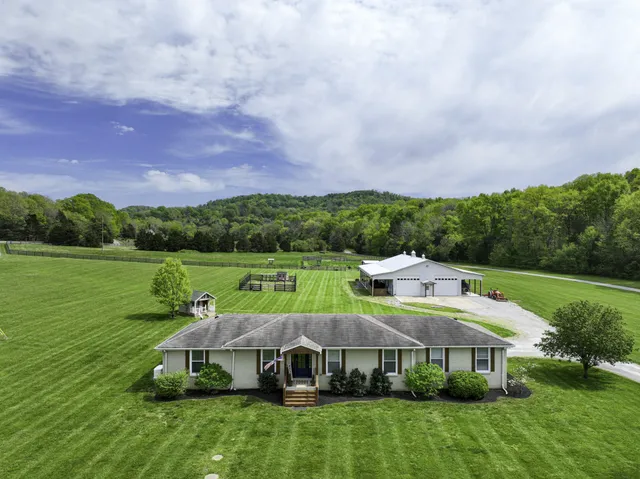 a aerial view of a house with a big yard