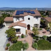 an aerial view of multiple houses with outdoor space