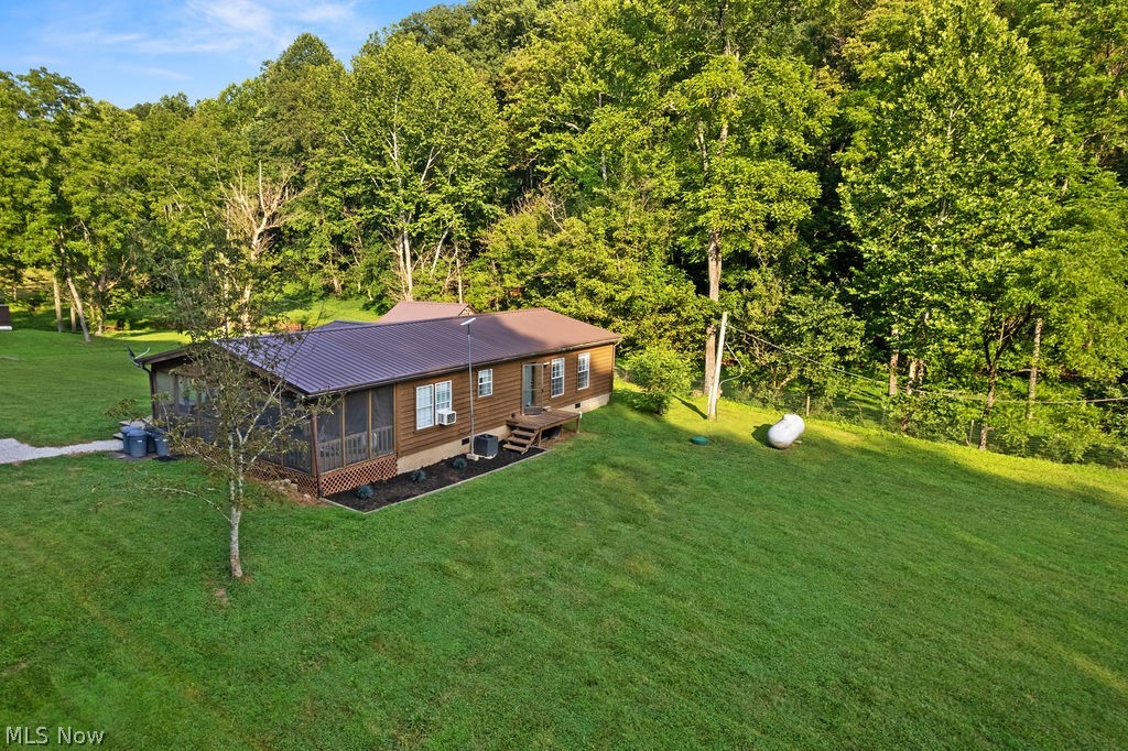 102 Logston Run Road Ravenswood, WV 26164 - Photo 25 of 42 Wood-sided residence featuring a brown metal roof