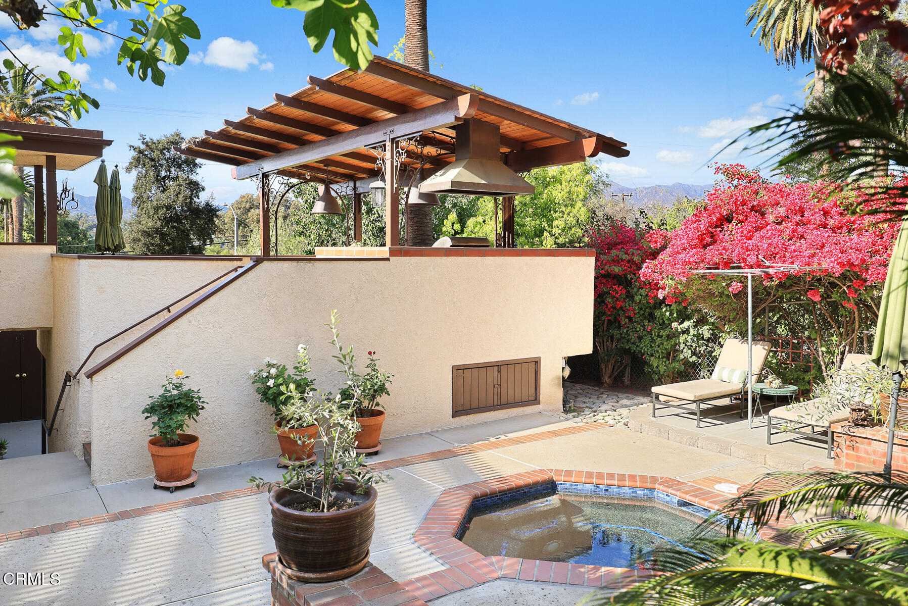 201 Monterey Road South Pasadena, CA 91030 - Photo 31 of 60 a view of a patio with table and chairs potted plants