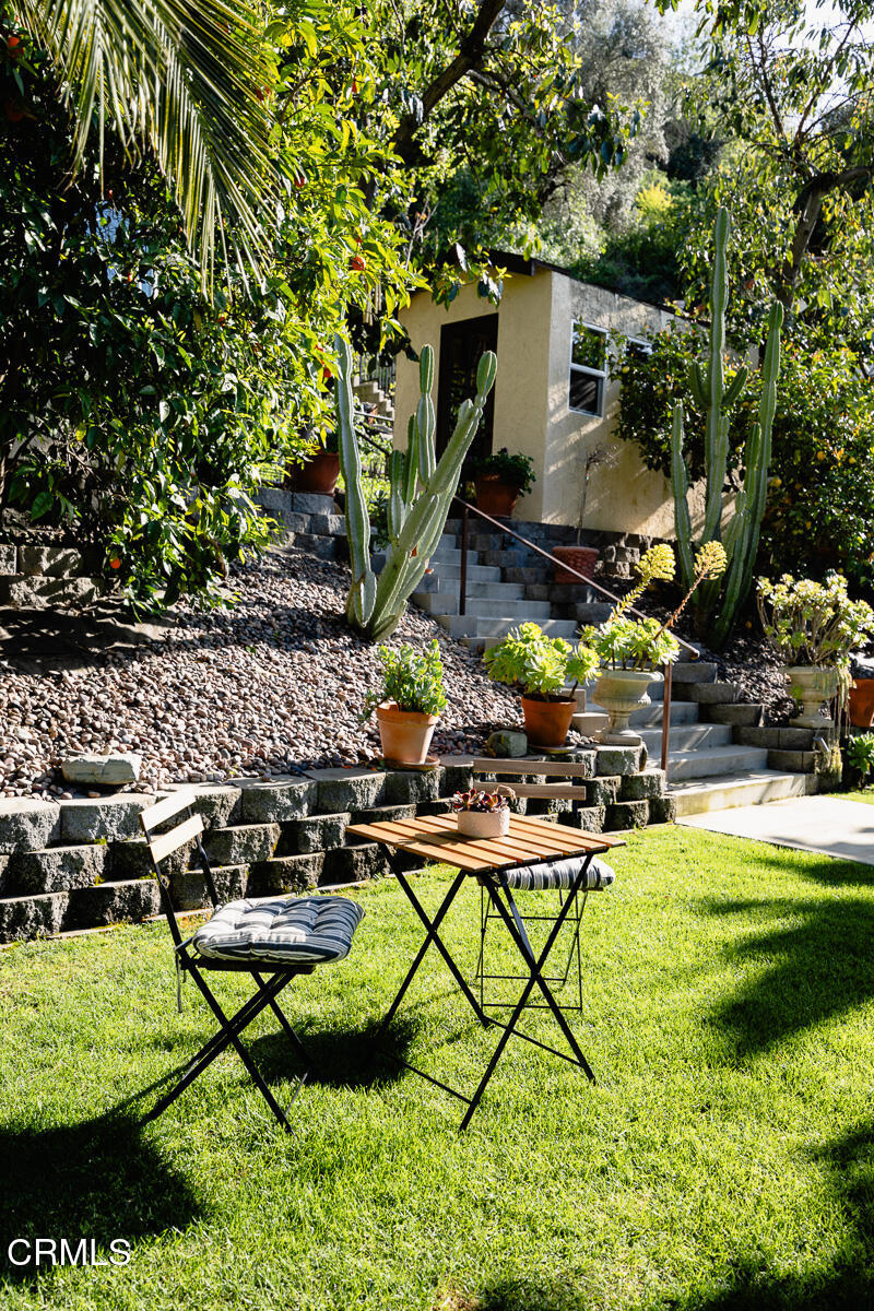 201 Monterey Road South Pasadena, CA 91030 - Photo 39 of 60 a backyard of a house with table and chairs