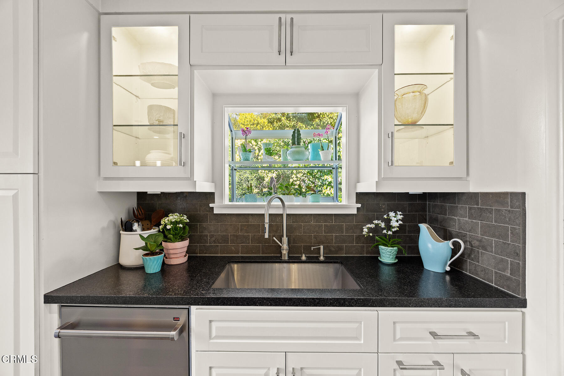 201 Monterey Road South Pasadena, CA 91030 - Photo 6 of 60 a kitchen with a window a sink and lots of white cabinets