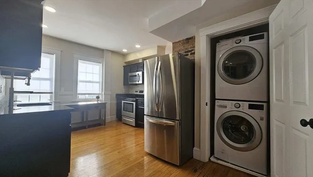 a view of a kitchen with washer and dryer