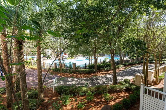 a living room with furniture a dining table and kitchen view