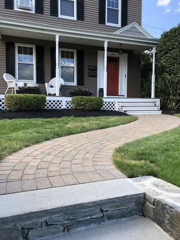 a kitchen with stainless steel appliances granite countertop a stove top oven microwave and cabinets