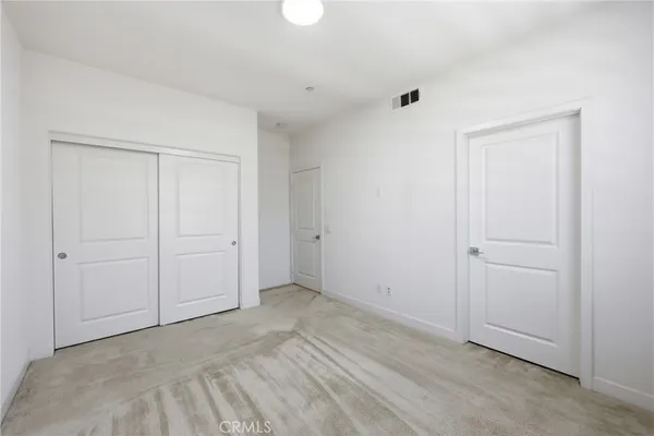 a view of a house with swimming pool and sitting area