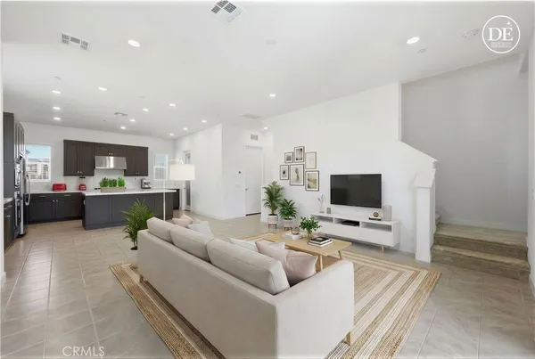 a view of kitchen with stainless steel appliances a refrigerator and microwave