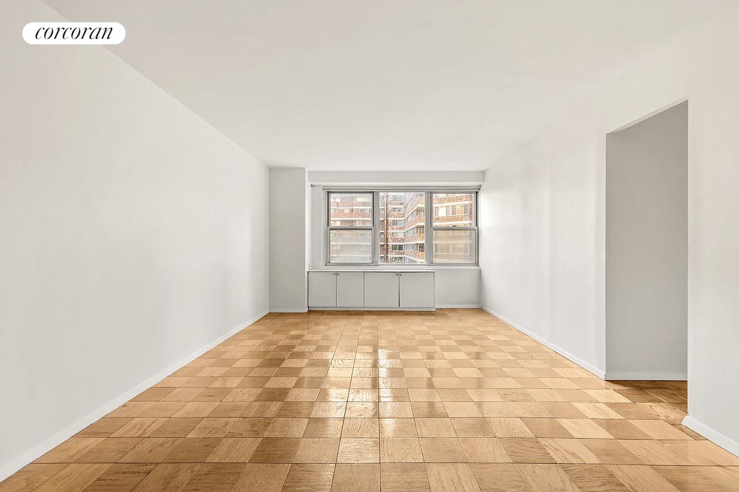 305 East 24th Street, Unit 5S Manhattan, NY 10010 - Photo 2 of 8 a view of an empty room and window