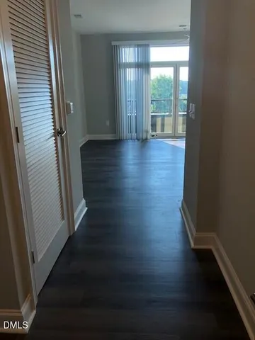 a view of wooden floor and windows in a room