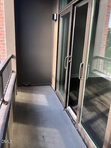 a view of an entryway with floor to ceiling window