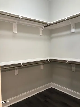 a close view of a closet with wooden floor