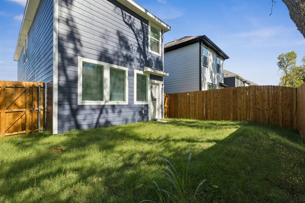 317 Clematis Street Princeton, TX 75407 - Photo 35 of 38 View of property exterior with a fenced backyard and a gate