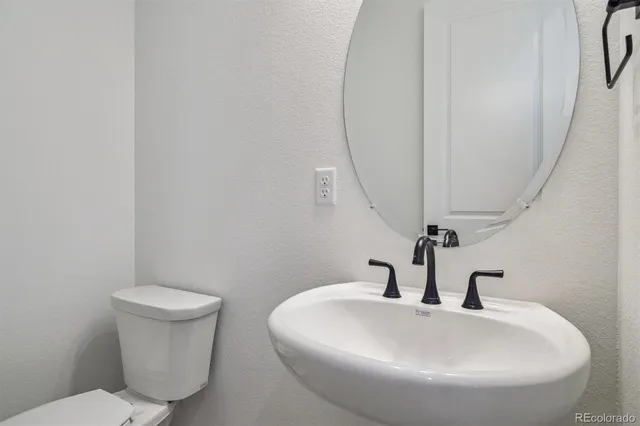 a bathroom with a toilet and a sink