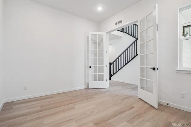 a view of entryway with wooden floor