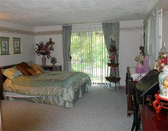 8 Gary Road Chelmsford, MA 01824 - Photo 11 of 17 a bedroom with a bed and a table
