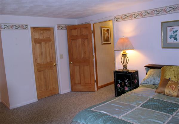 8 Gary Road Chelmsford, MA 01824 - Photo 13 of 17 a bedroom with a bed and a table in it