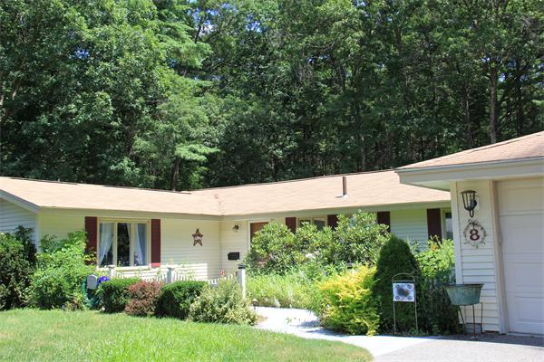 8 Gary Road Chelmsford, MA 01824 - Photo 2 of 17 a view front of house with a yard and potted plants
