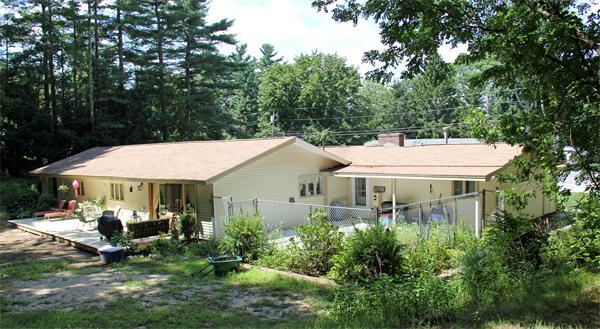8 Gary Road Chelmsford, MA 01824 - Photo 3 of 17 a view of a white house next to a yard with big trees