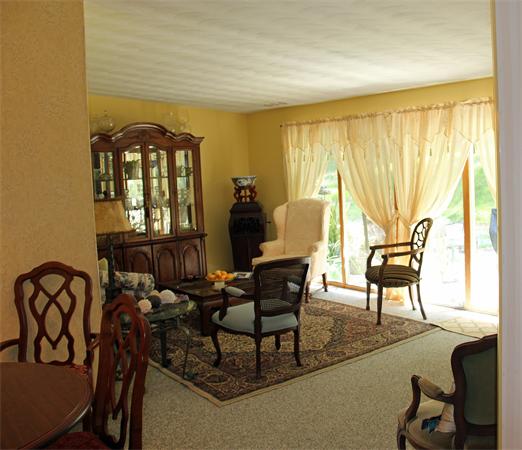 8 Gary Road Chelmsford, MA 01824 - Photo 6 of 17 a living room with furniture and a large window