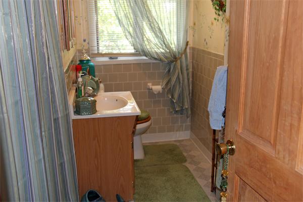 8 Gary Road Chelmsford, MA 01824 - Photo 7 of 17 a bathroom with a sink a window and shower