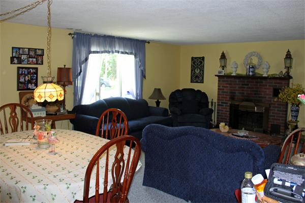 8 Gary Road Chelmsford, MA 01824 - Photo 9 of 17 a living room with furniture fireplace and a large window