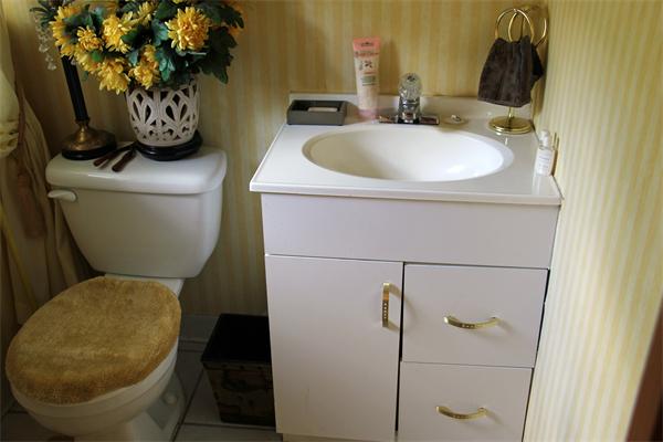 8 Gary Road Chelmsford, MA 01824 - Photo 10 of 17 a bathroom with a toilet sink and mirror