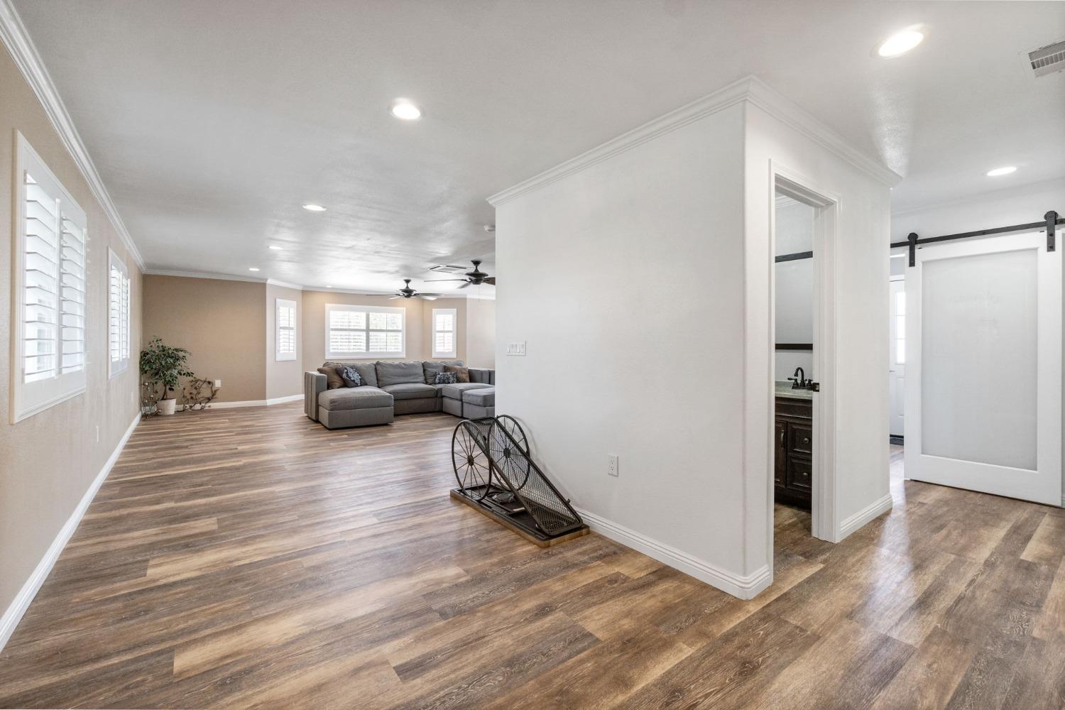 16972 Monreal Road Madera, CA 93636 - Photo 15 of 34 a view of a living room and a wooden floor