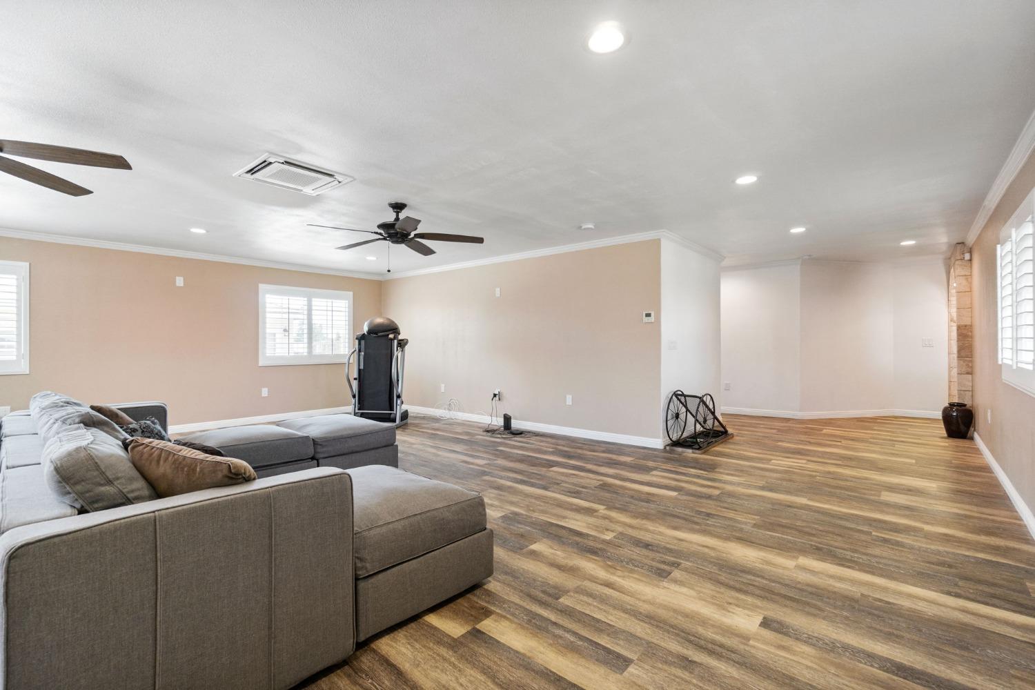 16972 Monreal Road Madera, CA 93636 - Photo 18 of 34 a living room with furniture and a window