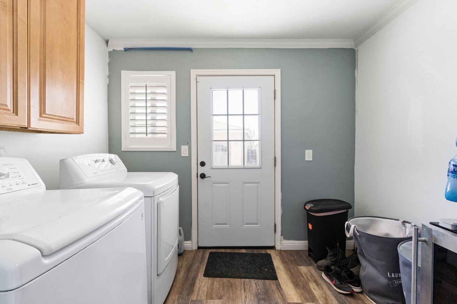 16972 Monreal Road Madera, CA 93636 - Photo 20 of 34 a room with a couch and a washer dryer