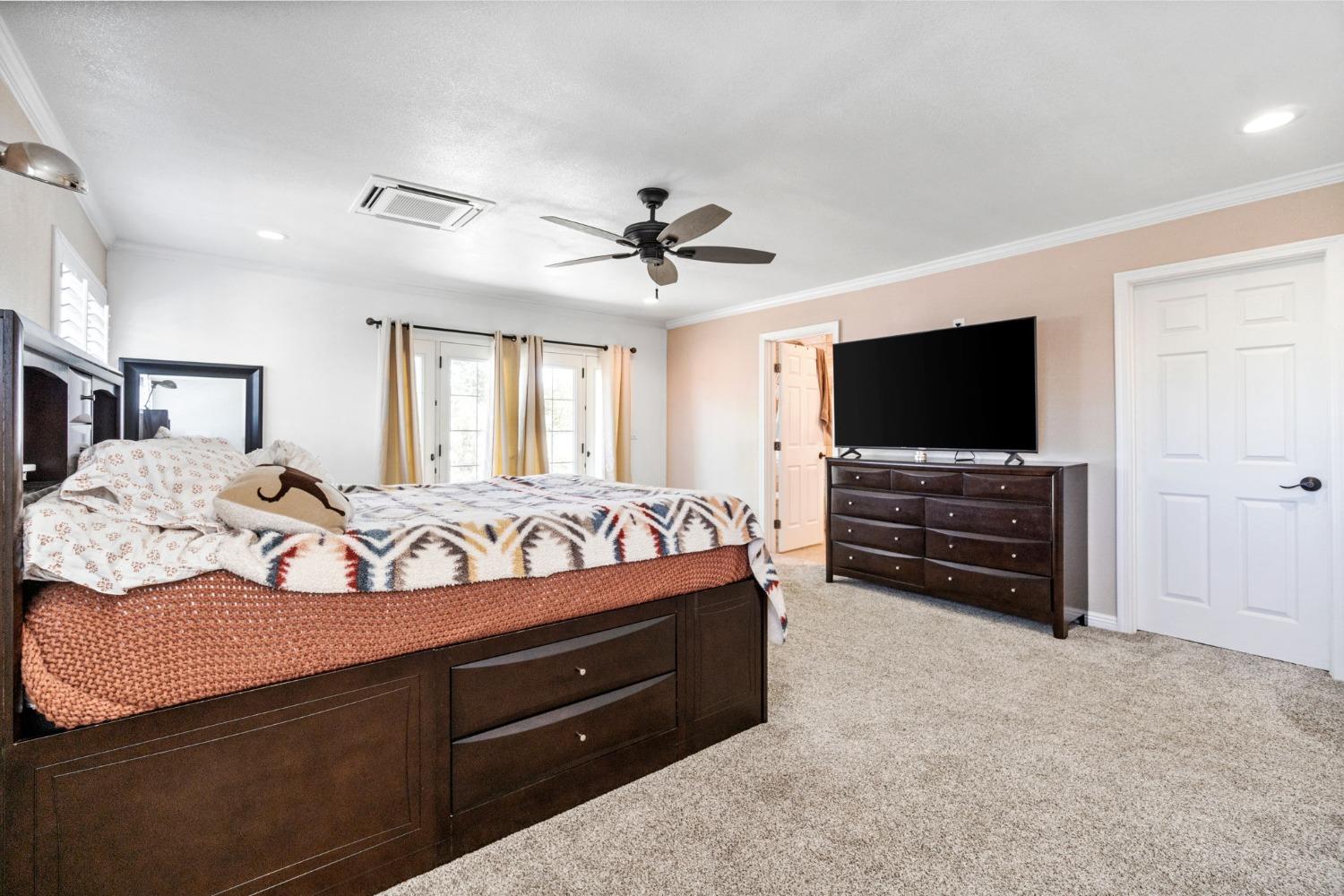 16972 Monreal Road Madera, CA 93636 - Photo 23 of 34 a living room with furniture and a flat screen tv