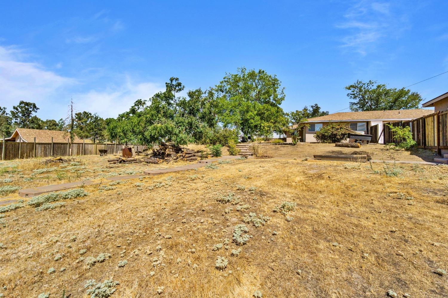 16972 Monreal Road Madera, CA 93636 - Photo 28 of 34 a view of a swimming pool with an outdoor space and seating area