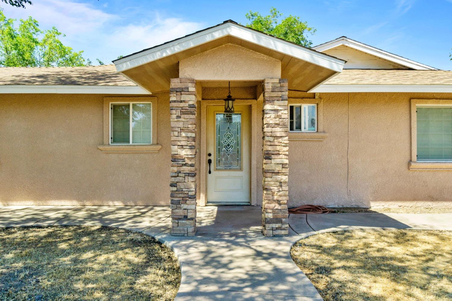 16972 Monreal Road Madera, CA 93636 - Photo 30 of 34 a view of a house with wooden fence