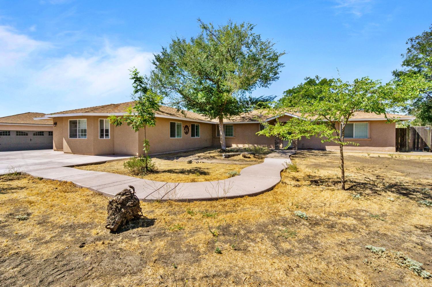 16972 Monreal Road Madera, CA 93636 - Photo 3 of 34 a view of a house with swimming pool