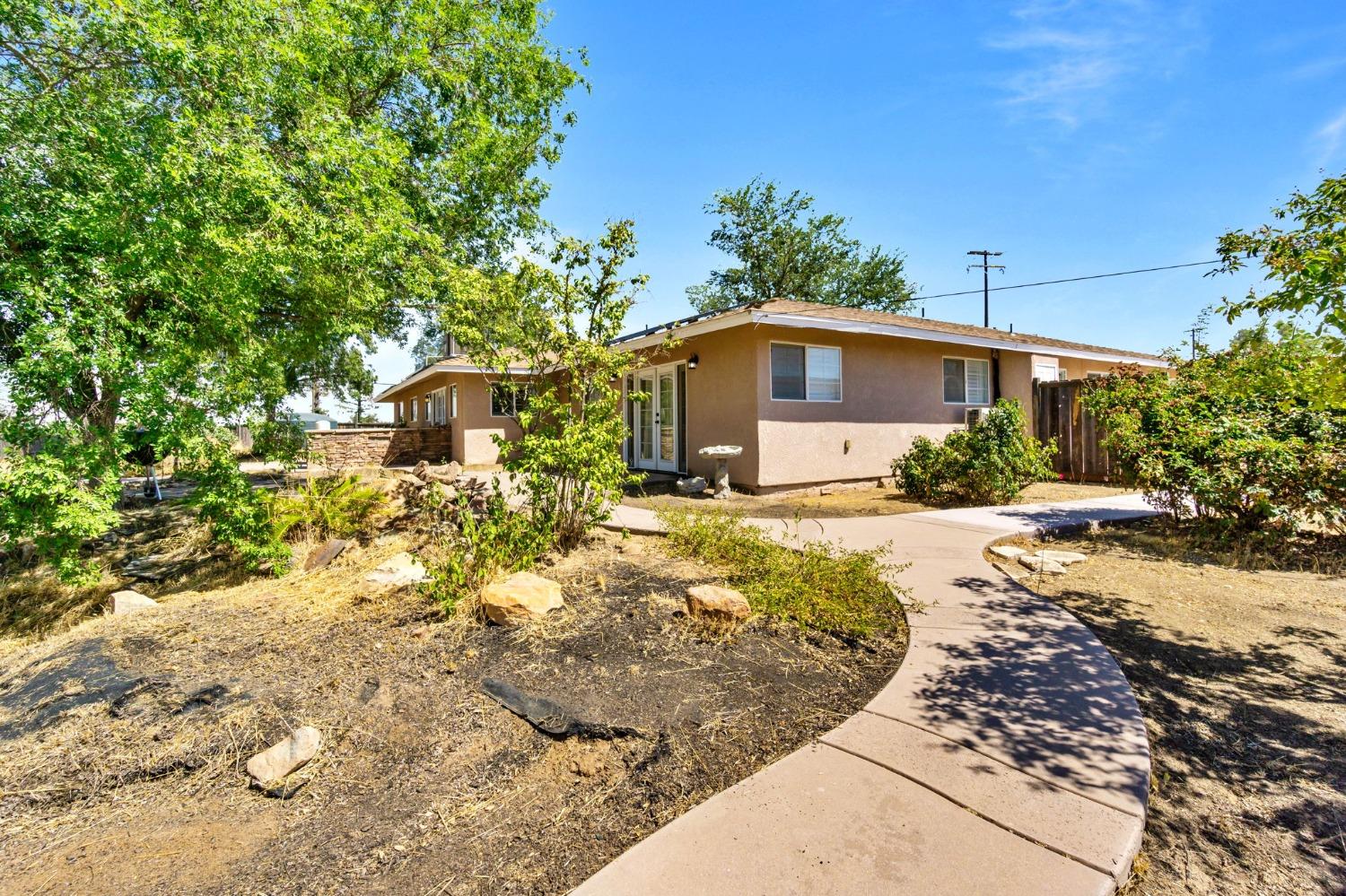 16972 Monreal Road Madera, CA 93636 - Photo 34 of 34 a view of a house with a yard