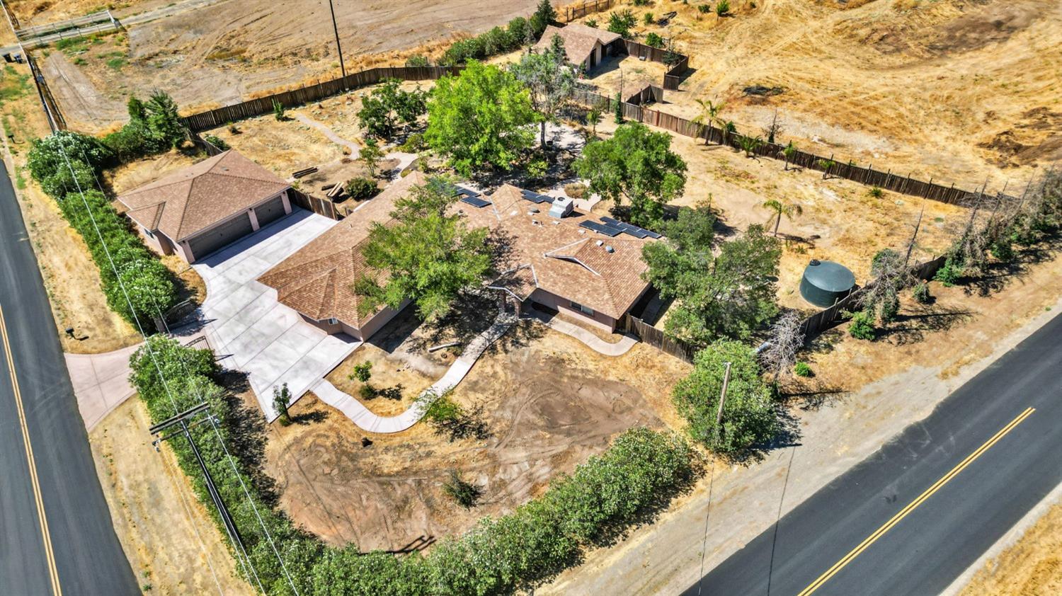 16972 Monreal Road Madera, CA 93636 - Photo 4 of 34 an aerial view of residential houses with outdoor space