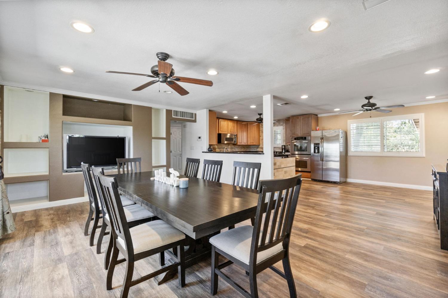 16972 Monreal Road Madera, CA 93636 - Photo 6 of 34 a view of a dining room with furniture window and wooden floor