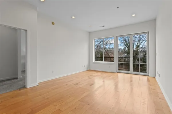 a view of an empty room with a window