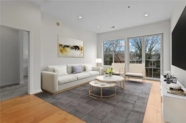 a living room with furniture and a large window