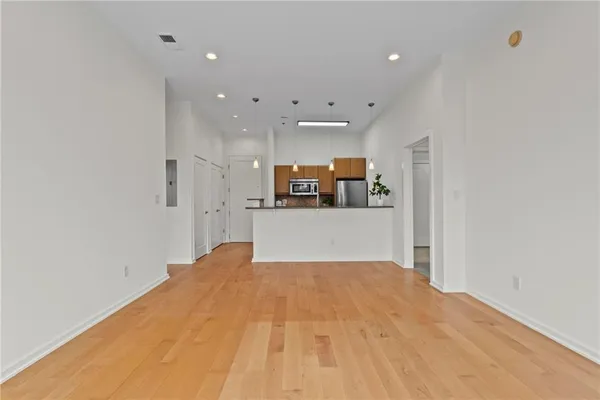 a bedroom with a bed and cabinets