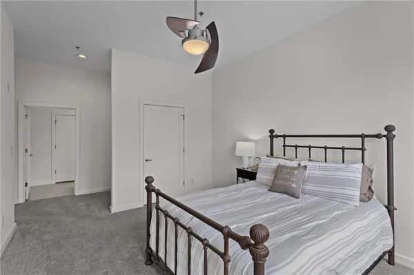 a bathroom with a sink a mirror a glass door a shower and vanity