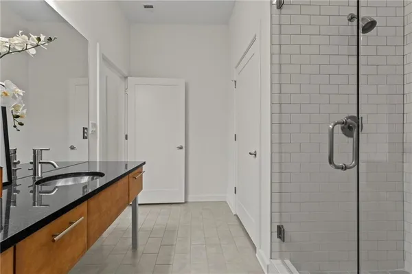 a bathroom with a sink a mirror and a bathtub