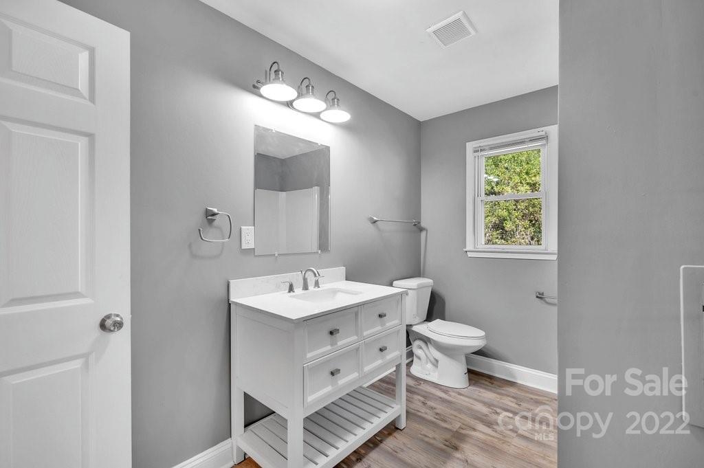 609 Unique Street Chester, SC 29706 - Photo 14 of 22 a bathroom with a toilet sink and mirror
