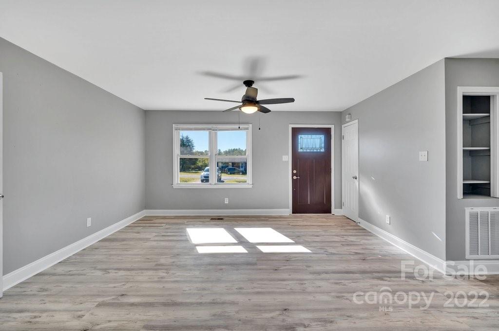 609 Unique Street Chester, SC 29706 - Photo 8 of 22 a view of a room with a window and a ceiling fan