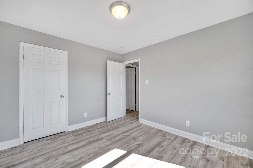 609 Unique Street Chester, SC 29706 - Photo 10 of 22 a view of an empty room and wooden floor